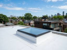 Reroofing? 4 Reasons To Upgrade A Drafty, Leaky Skylight To Modern Flat Glass With Integrated Flashing